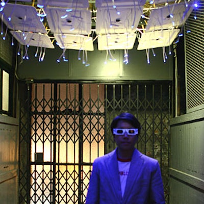 Artist James Clar created a light installation in the freight elevator of the Xchange, which, hoping to create a sense of the unexpected, producers used to transport guests to the exhibit space. When viewed through 3-D glasses, the lights flickered. Indian and Chinese music played during the ride to the gallery space.