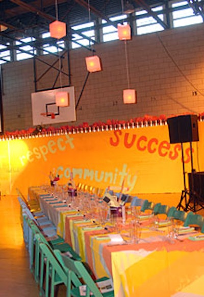 For the dinner portion of the event, guests sat amongst basketball hoops and scoreboards in the school’s gym.