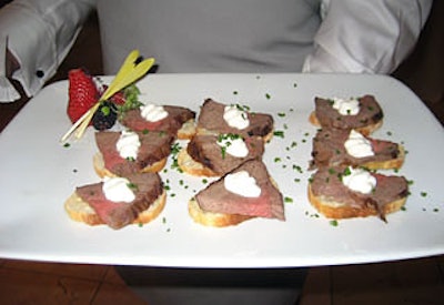 Guests snacked on appetizers made in TurboChefs on-site; the recipes appeared in the cookbook from the night’s gift bag, with contrasting cooking times for the TurboChef and for conventional ovens noted for each. Offerings included beef filet on Parmesan crostini.