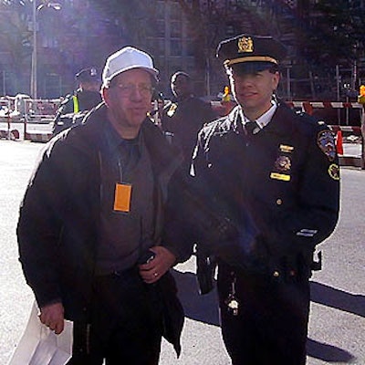 Parade guru Elliot Winick posed with a NYPD officer.