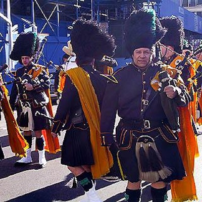 The NYPD Emerald Society Pipes and Drums corps tried to keep warm while waiting for the parade to begin.