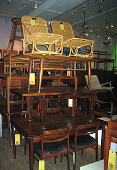 Furniture was stacked three and four stories high to create more space for mingling in the aisles.