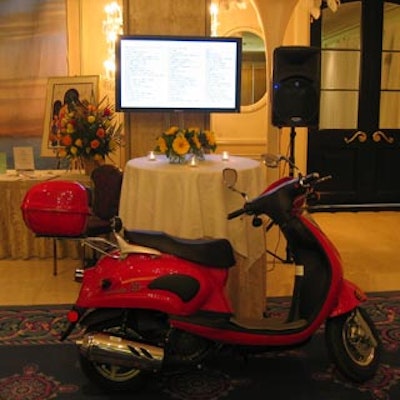 A lucky guest won this red Vespa motor scooter.