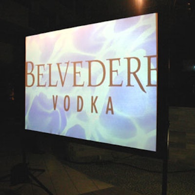 Flat-screen monitors advertised the fashion show's sponsors, which included Acura, Belvedere Vodka, and the Flamingo South Beach.