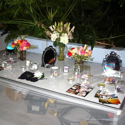 Tweezerman set up vanity tables complete with mirrors, fresh-cut flowers, and product samples.