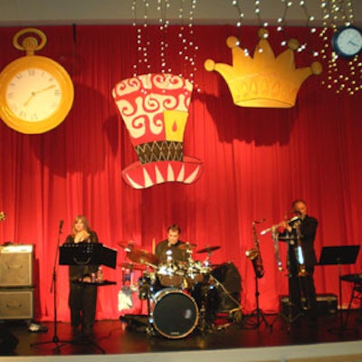 Fast Forward performed against a bright red backdrop customized with oversize props.