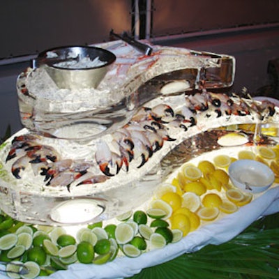 A two-tiered ice sculpture offered stone crabs, Alaskan king crab legs, crab claws, and lump blue crab meat. Wedges of lemons and limes added a shot of color.