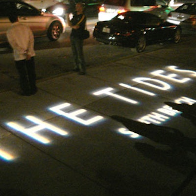 Balmelli Creative Events projected the Tides logo in white on the sidewalk at the entrance.