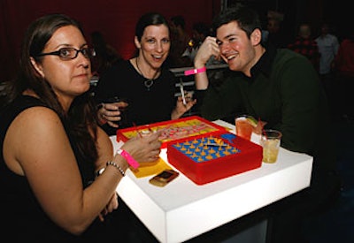 Guests played board games on high Lucite tables lit from within.