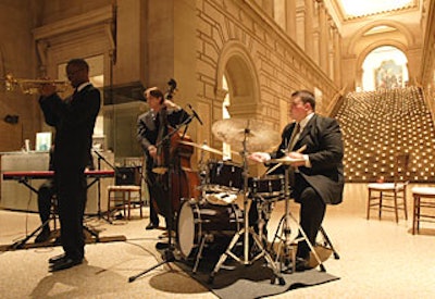 During the reception, a quartet from Juilliard played jazz; behind them, the staircase glowed with the light from hundreds of votive candles.