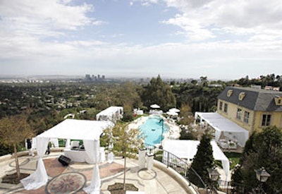 Staff led guests behind the house, where a pool area and two patios above it served as a stylish playpen for guests.