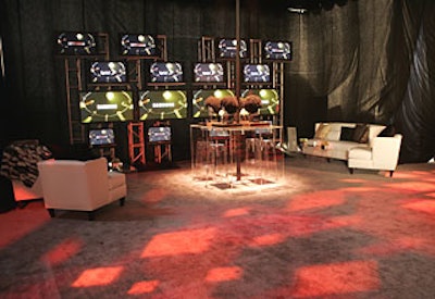 Guests found a nightclublike experience under a tent, which was filled with flat-screen TVs and logos.