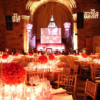 On tabletops, designer Ed Libby’s spherical motif took the form of globes of fuchsia roses as centerpieces.