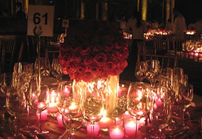 In another nod to City Harvest’s 25th anniversary and the event’s signature colors, tabletop arrangements incorporated glass boxes filled with silver beads, pink candles, and pink votives, as well as silver organza tablecloths embroidered with fuchsia flowers and silver vines.