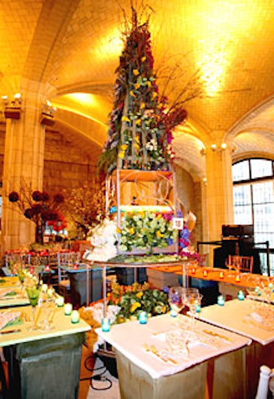 Susan Edgar’s wholly original centerpiece was a large revolving tower with seasonal flowers on each of its four faces. Surrounding the spire, diners got their own individual tables: fabric-covered platforms placed over enormous ceramic planters. Each seasonally hued table had crisscrossed garden gloves as a place mat.