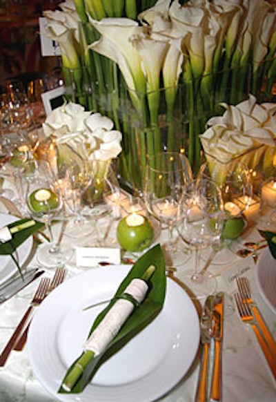 Flora New York creatively rolled napkins around stalks of bamboo at each place setting. (A single calla lily stem also dotted the back of each guest’s chair.)