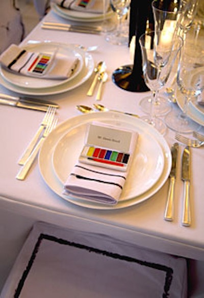 Prudence Designs turned its table into a color-by-numbers piece. Individual watercolor sets sat at each place setting (holding name cards) so guests could paint their choice of season on the white canvas of the tabletop and chair coverings.
