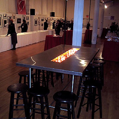 Musters & Company put tables with candles and stools in various areas of Metropolitan Pavilion, so guests could sample the food from Match Catering between browsing the silent auction items.