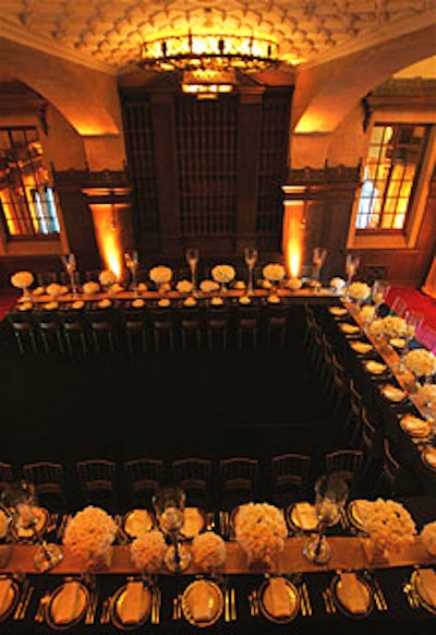 Guests dined at a U-shaped banquet-style table under the vaulted ceilings of a theater in a private Bel Air estate that was originally built in 1927 for then general manager and vice president of Fox Studios Winfield Sheehan.