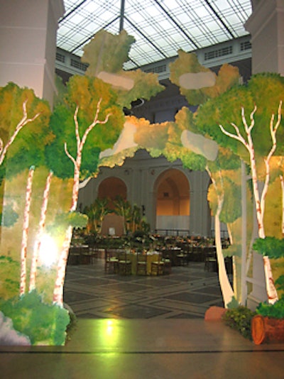 To soften the court’s four archways, Mark Ravitz Art & Design covered them with 8-to-16-foot-tall birch tree-shaped panels cut out of corrugated plastic and decorated with translucent paint. When lit from behind, the life-like trees cast an ethereal glow typical of Hudson River School works.