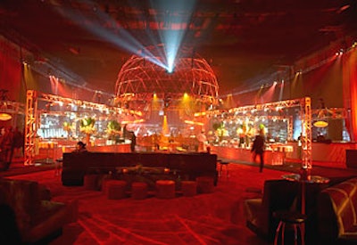 The metal spider’s body hovered over the dance floor at the center of the venue. For added visual excitement, green lasers shot through the space.