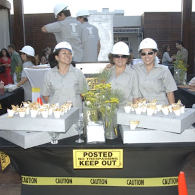 Outdoor food stations were decorated with yellow 'caution' tape and 'no trespassing' signage.