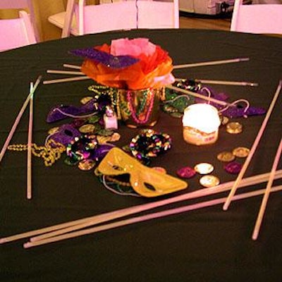Tables offered an array of Mardi Gras props, including masks, beeds and coins.