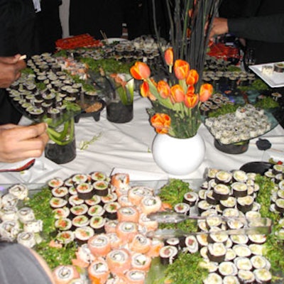 Orange tulips by Bamboo Flowers contributed to a colorful sushi display.