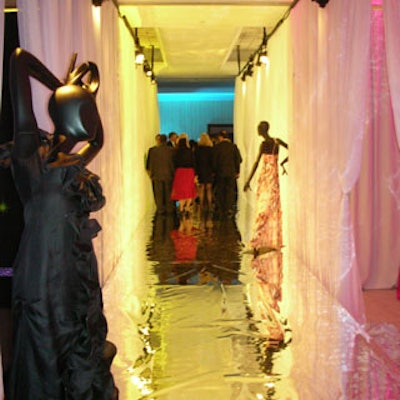 Guests walked a 60-foot silver runway flanked by Christian Lecroix-fashioned mannequins to connect to the four lounges and the food area in the back.