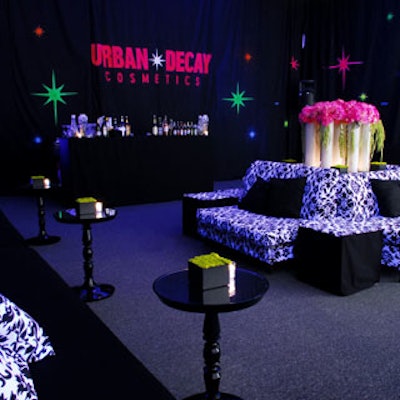 The Urban Decay lounge featured black-and-white furniture and intergalactic-looking walls.