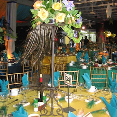 A wrought-iron pedestal and floral centerpiece stood five feet tall.