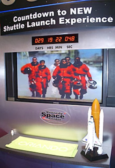The Kennedy Space Center Visitor Complex’s booth featured a digital countdown to the debut of its new $60 million Shuttle Launch Experience ride.
