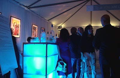 A tented area adjacent to the show floor featured illuminated bars.