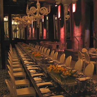 White Paper chandeliers hung above a black communal table in the dining area.