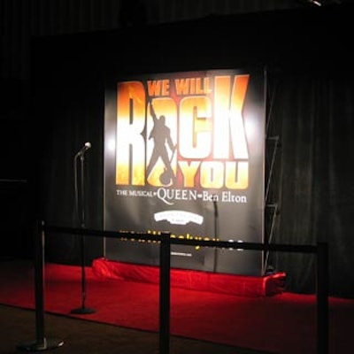 A large poster of the show served as a backdrop for photos.