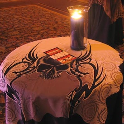 Silk scarves decorated with psychedelic patterns and skull images covered the cocktail tables.