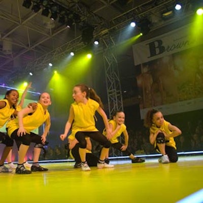 Youth The Denise Lester Dance School performed in black-and-yellow outfits and Sketcher running shoes.