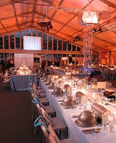 On tables, smaller versions of the model piano hanging from the crane in the center of the tent echoed the imposing structure.