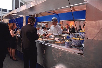 Servers wore silver hard hats, white shirts, and blue jeans and poured coffee during dessert from large Thermos bottles into blue tin mugs.