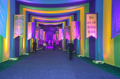 Attendees entered the event space through a striped fabric tunnel, which led into the cocktail area.