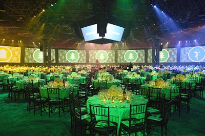 Stark divided the large dining space into four zones, delineated by the colors (apple green, yellow, peacock blue, and kelly green) of the table linens and graphics on video screens that wrapped around the perimeter—and gave everyone some help in orienting themselves in the giant space.