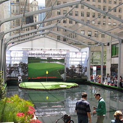 Taking over a large chunk of sidewalk next to the Rockefeller Center rink for the 10-day promotion, the course included a replica of the difficult 17th hole of the Tournament Players Club at Sawgrass. Behind the green, a large LED screen showed live television coverage of the PGA competition.