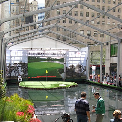 Taking over a large chunk of sidewalk next to the Rockefeller Center rink for the 10-day promotion, the course included a replica of the difficult 17th hole of the Tournament Players Club at Sawgrass. Behind the green, a large LED screen showed live television coverage of the PGA competition.