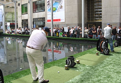 Golfers each had one shot, winning a sleeve of balls if they made it to the green or a set of clubs if they made a hole-in-one.