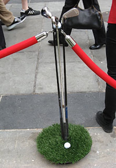 The stanchions that cordoned off the area had a golf theme, with clubs sitting atop round plots of grass.