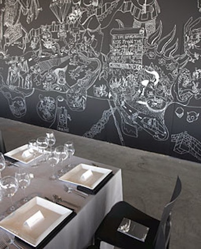 An intricate chalk mural by Ernest Concepcion decorated a wall in the dinner area.