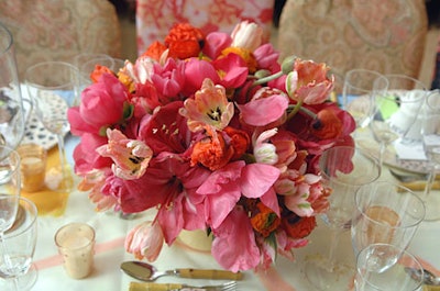 A silk tablecloth hand-painted with a Poiret design covered each table, linen napkins folded into the shape of a rose sat atop each plate, and chair covers came in shades of peach, pink, blue, and green.