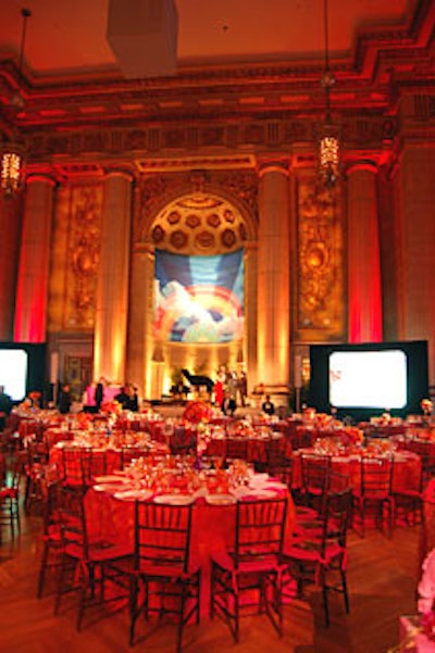 The auditorium's bright color palette of hot pink, orange, yellow, and lavender mimicked an Indian spice market.