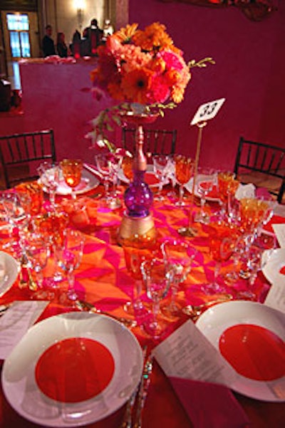 Two-foot-tall hookahs served as vases forarrangements of orchids, tulips, gerbera daisies, carnations, and even smallpineapples, created by Suzanne Codi Floral Designs.