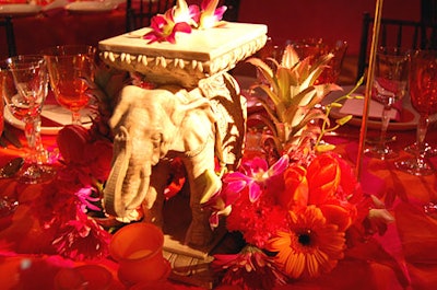 Carolyn Peachy of Campbell Peachy & Associates created the tabletop centerpieces, which featured scaled-down reproductions of props from the play, including hookahs, elephant pedestals, and '60s-style suitcases.